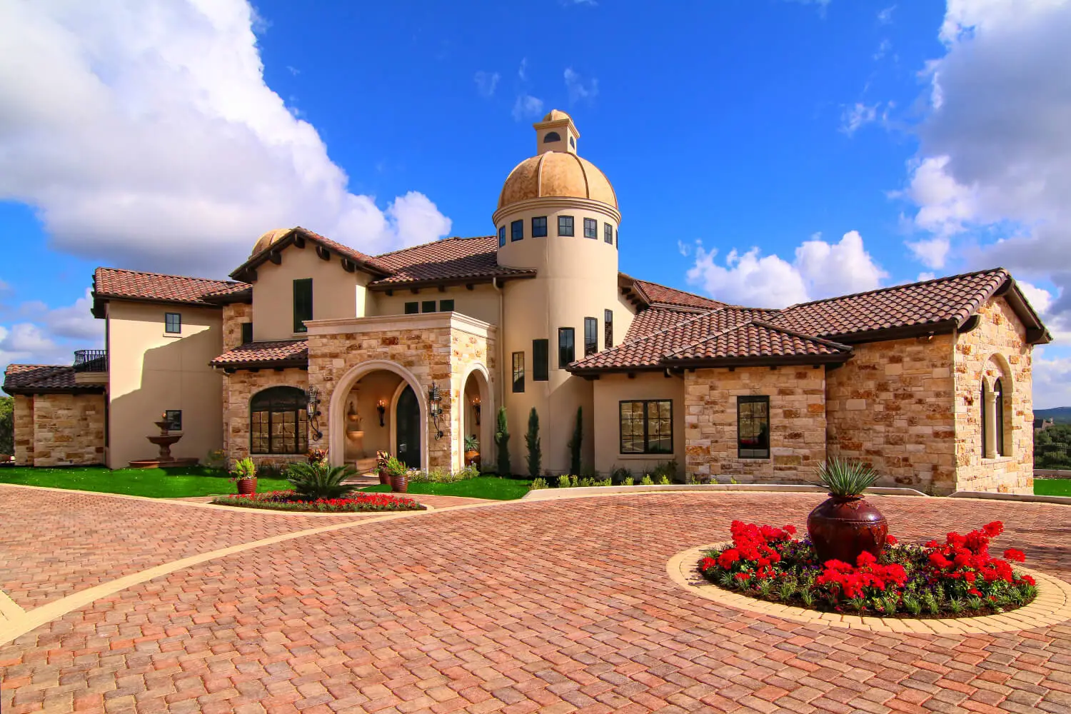 Rear elevation with a curved two-story loggia and balcony, above a pool and spa.